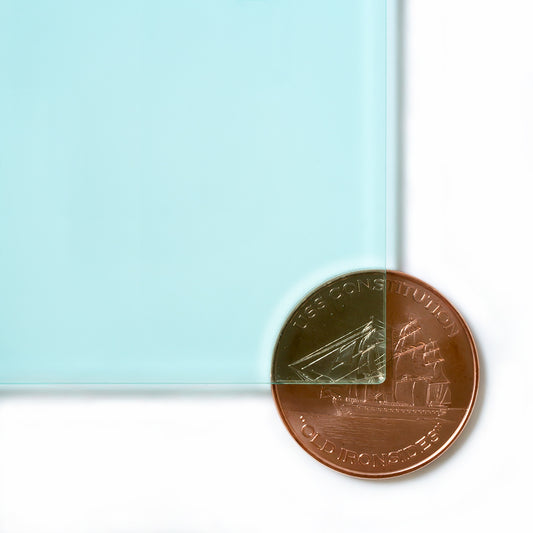 2111 Coke Bottle Green transparent cast acrylic sheet sample with penny for scale