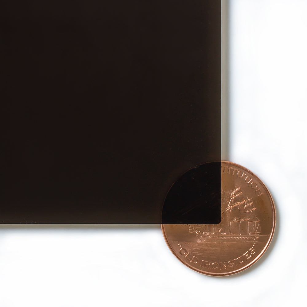 2370 Bronze transparent cast acrylic sheet sample with penny for scale