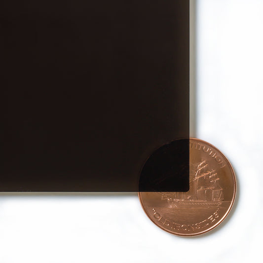 2370 Bronze transparent cast acrylic sheet sample with penny for scale