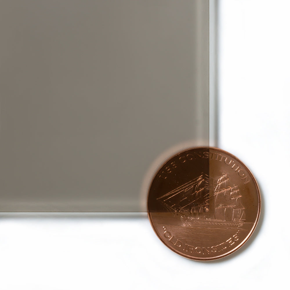 2404 Grey transparent cast acrylic sheet sample with penny for scale