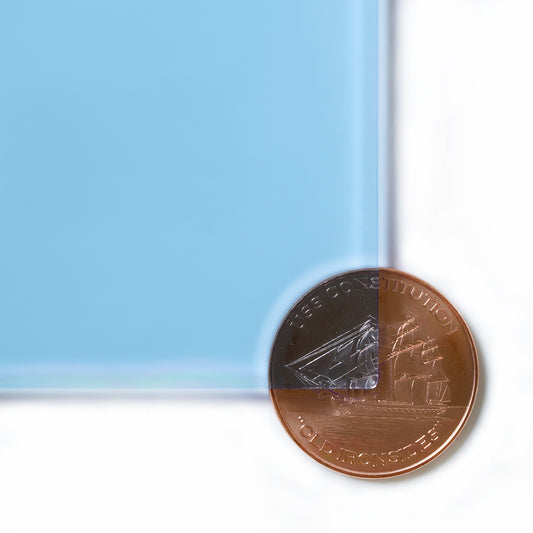 9092 Fluorescent Blue edge-glow cast acrylic sheet sample with penny for scale