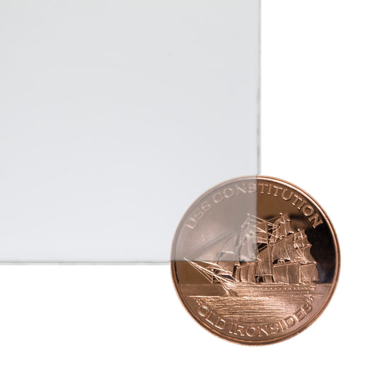 P95 matte clear frosted cast acrylic sheet sample with penny for scale